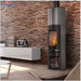 Stylish Edilkamin Tally S Evo 9,1 kW 🔥 in modern living room with stone wall and sleek furniture.